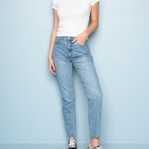 High-waisted medium wash boyfriend jeans.